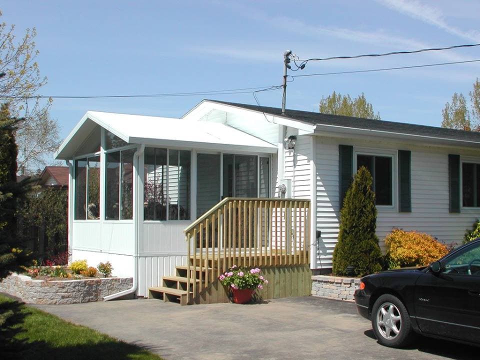 Custom 3 season screened sunroom with panoramic backyard views Lambton County