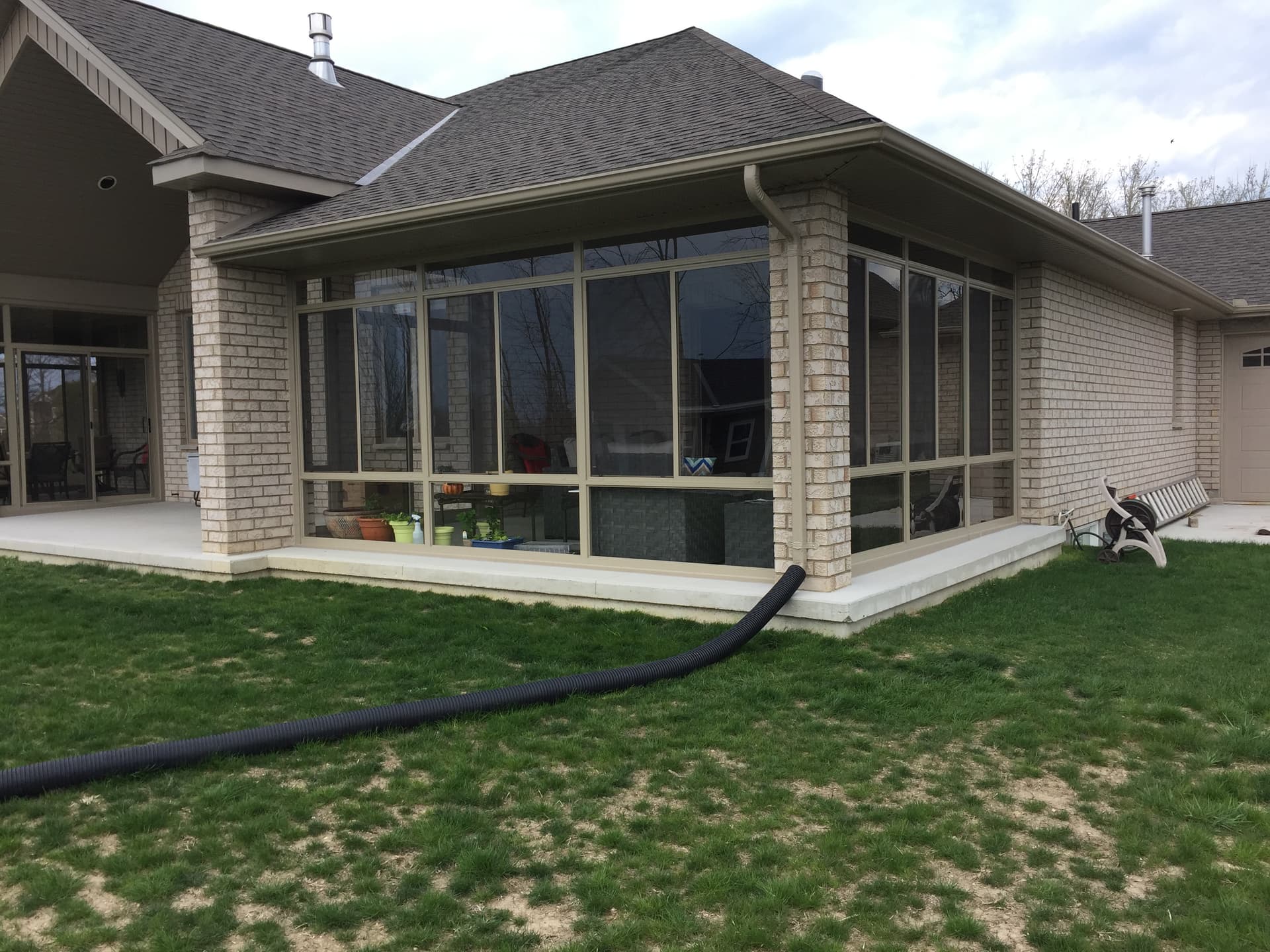 3 season sunroom enclosure in Sarnia with cozy interior