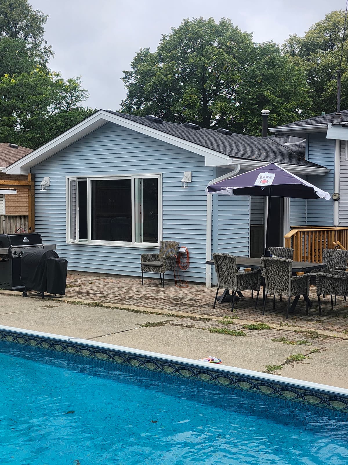 Modern sunroom addition home office with backyard views Lambton County