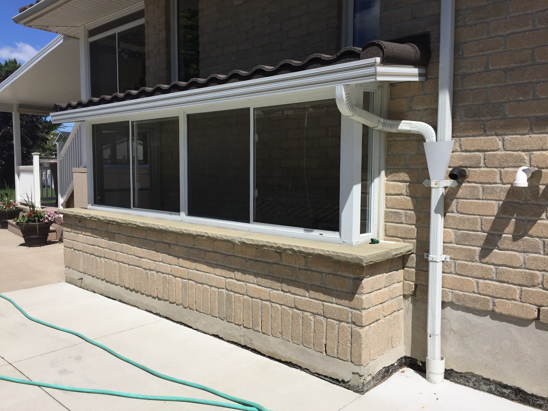 Grade entrance sunroom enclosure in Lambton County