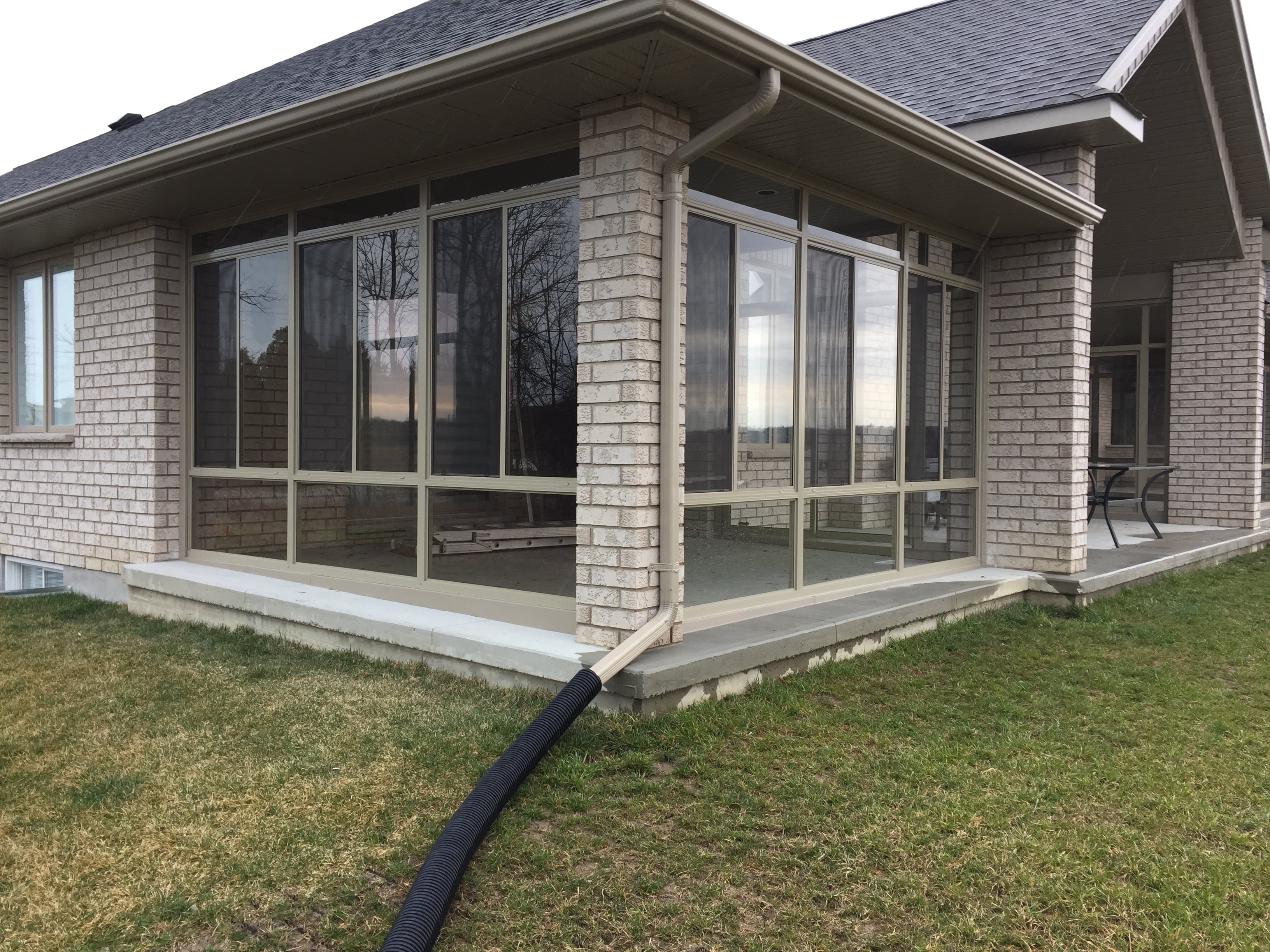 Custom sunroom enclosure transforming a patio – view 1